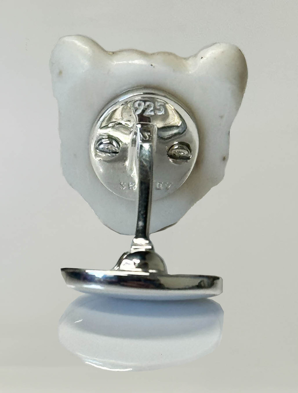 Hand Carved Bone Lion Cufflinks with Sapphire Eyes | Spivey - Harpers